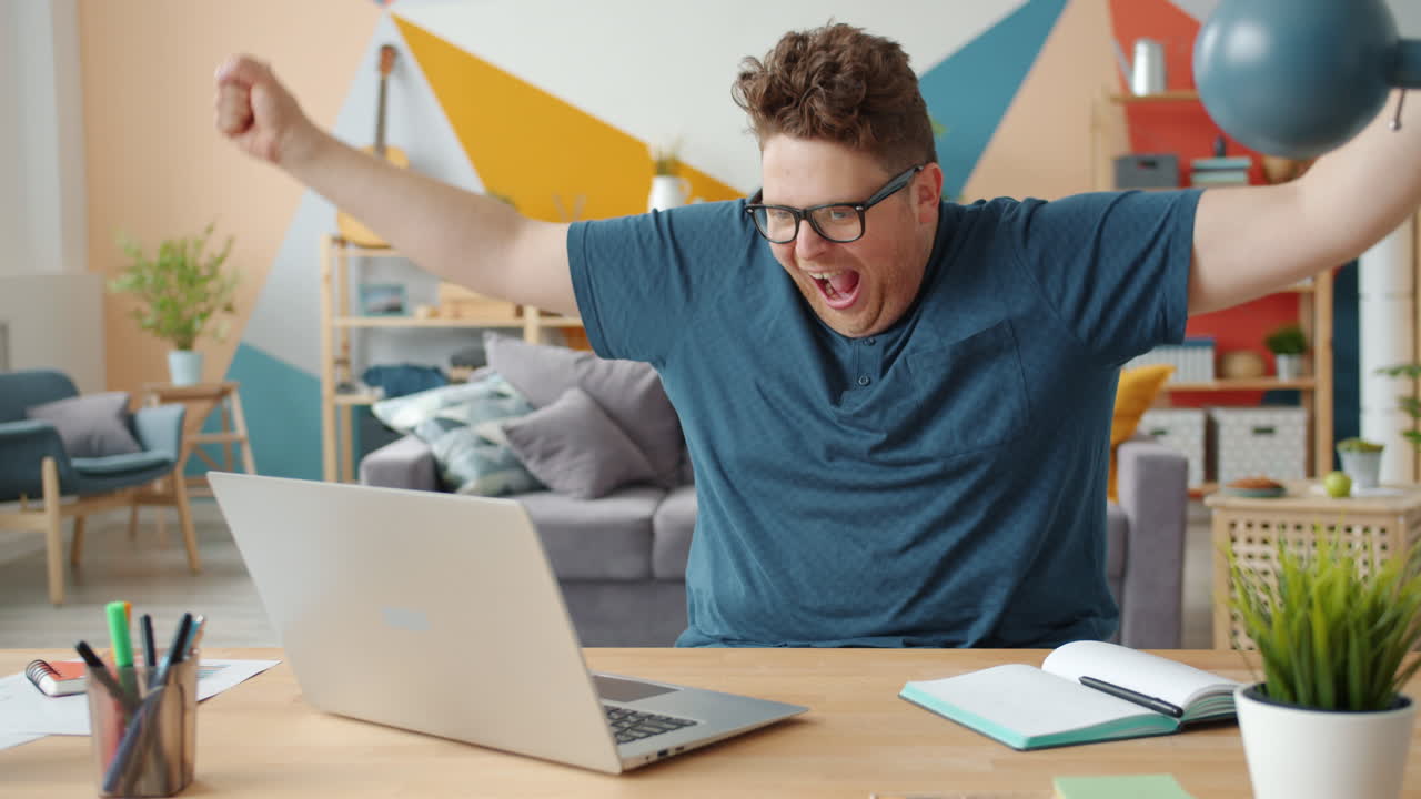 Excited Man Celebrating Success Online