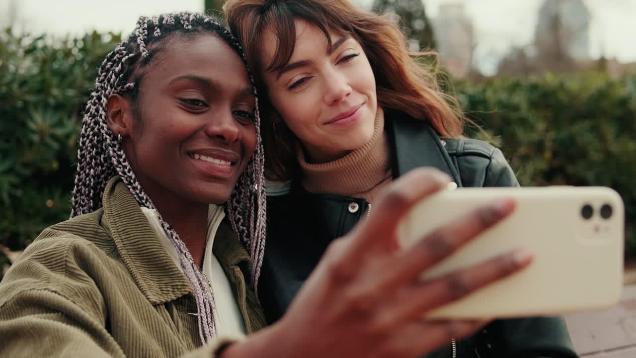 Diverse Friends Smiling and Taking a Selfie Outdoors