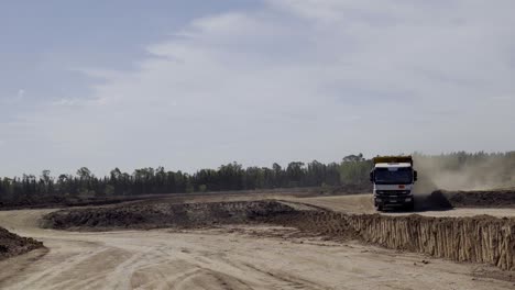 Freight-Truck-Maneuvering-Through-a-Dusty-Dirt-Road