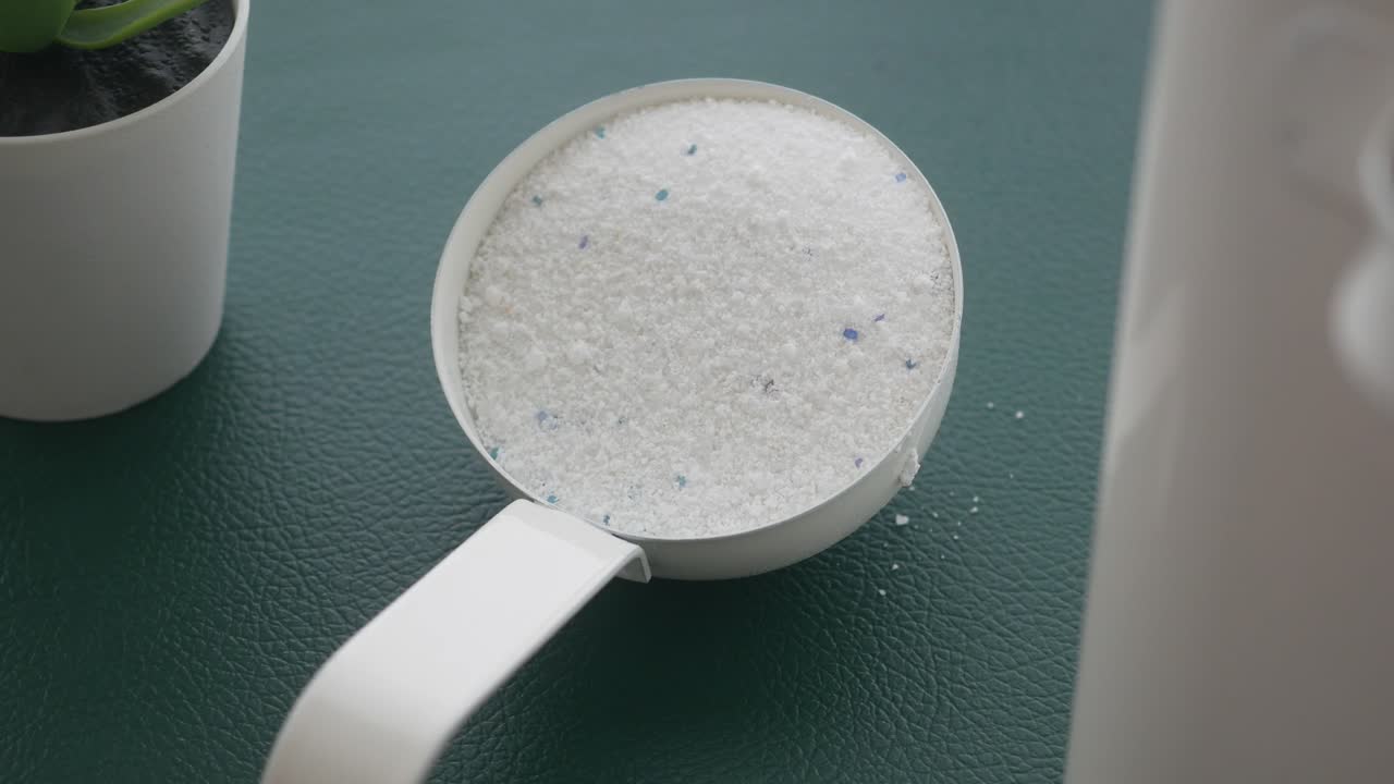 Laundry Detergent in Measuring Cup