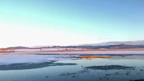 beautiful landscape with a lake and mountains in the background