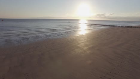 aerial: the beach between vlissingen and dishoek during sunset