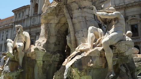 detail of one of the statues of the fountain of the four rivers, representing river nile, rome, italy