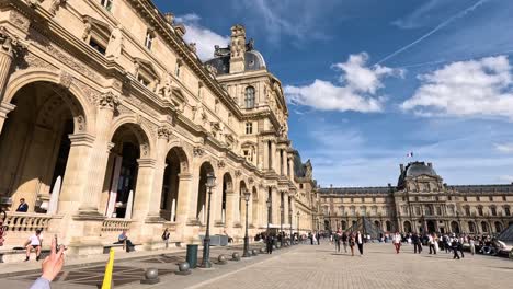 visitors at louvre museum, paris, enjoying the day