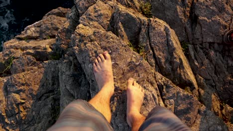 pov of standing on the edge of a cliff.