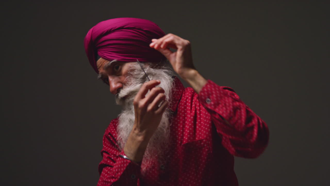 Free stock video Low key studio lighting shot of senior sikh man with