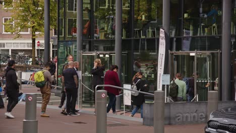 visitors queueing at the anne frank house in amsterdam