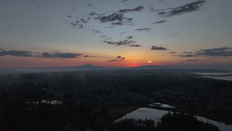 aerial view of the sun rising over oak harbor's neighborhoods on whidbey island