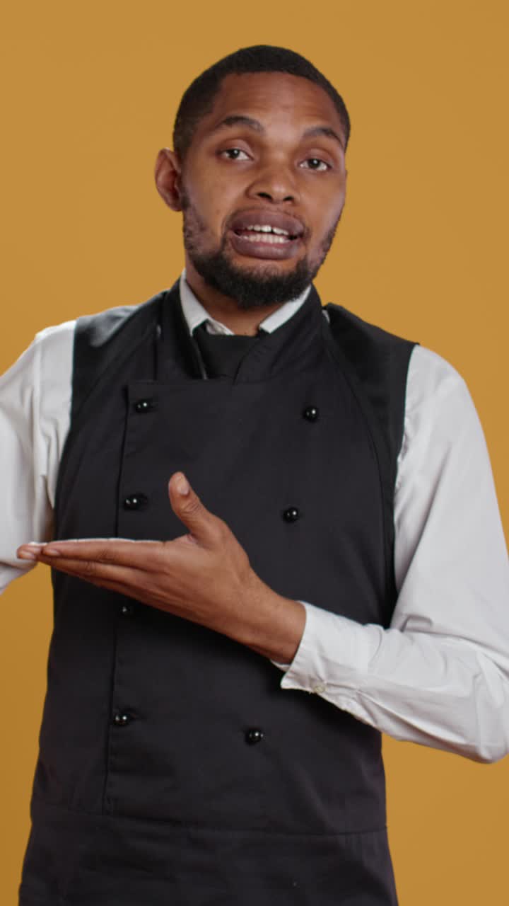 African American Chef Talking and Presenting with Hand Gesture