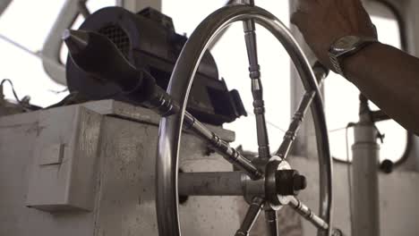 Hand-Steering-a-Boat-Close-Up