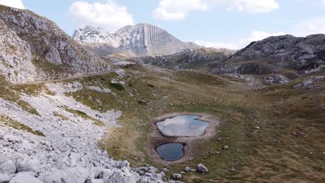 panoramic road and lakes at durmitor national park, montenegro - aerial forward