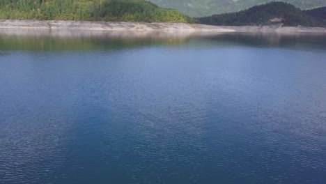 establishing 4k shot of lake, hills and forest, serbia