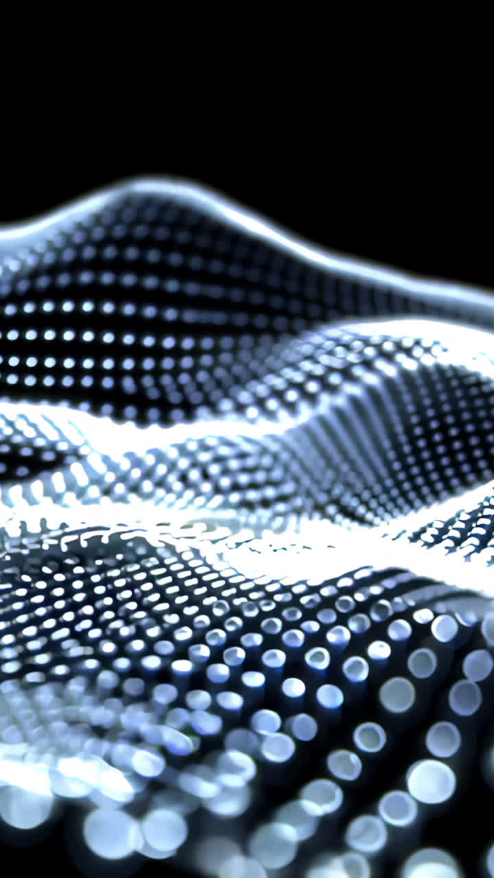 A close up of a blue and white surface with many small dots. The surface appears to be a wave or a mountain range. The image has a futuristic and abstract feel to it