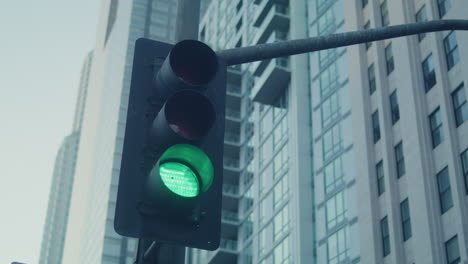 traffic light change color on crossroad big city. streetlight on road closeup