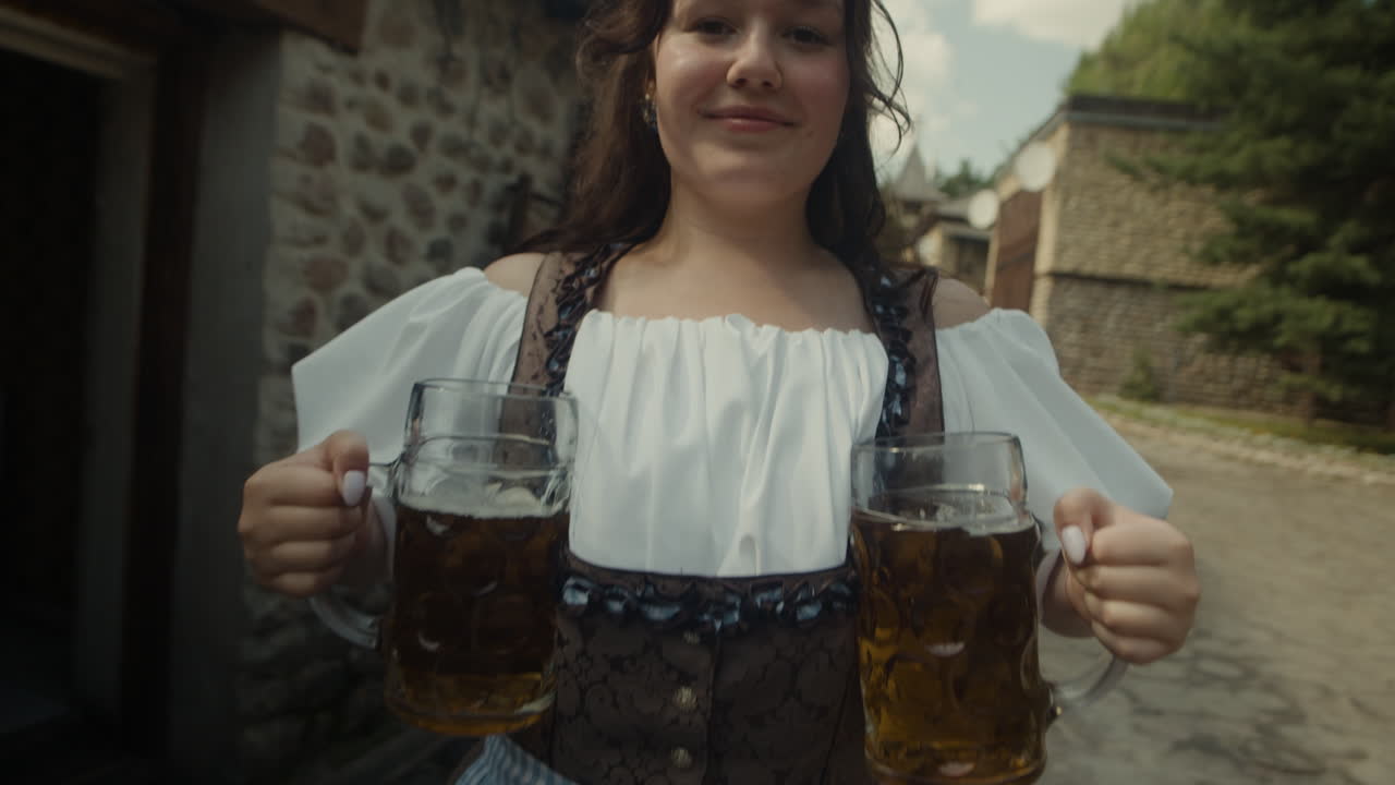 Woman in traditional dress serving beer