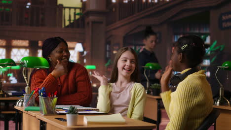 students discussing in a school library