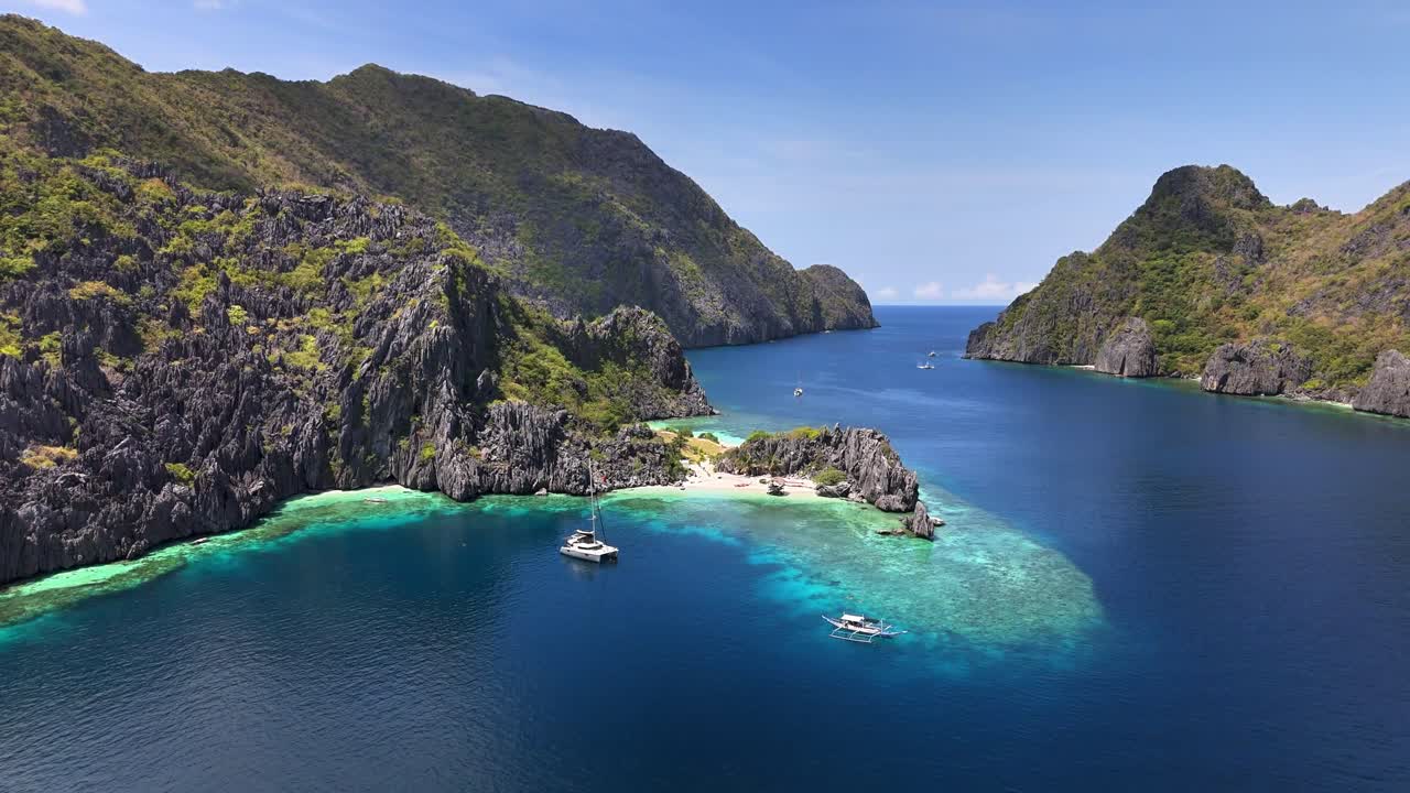Top notch aerial view of two boats and the Star Beach beautiful scenery , in Tapiutan Island, Philippines