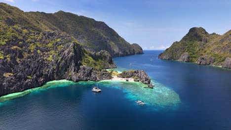 top notch aerial view of two boats and the star beach beautiful scenery , in tapiutan island, philippines