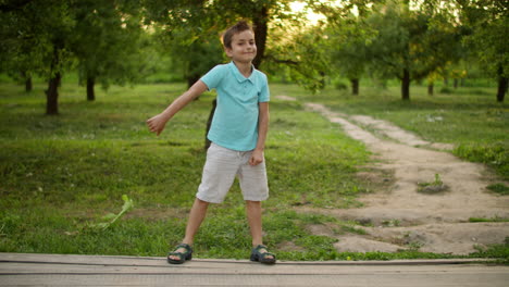 smiling teenage boy dancing outside