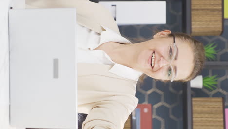 Vertical-video-of-Cheerful-business-woman-dancing-looking-at-camera.