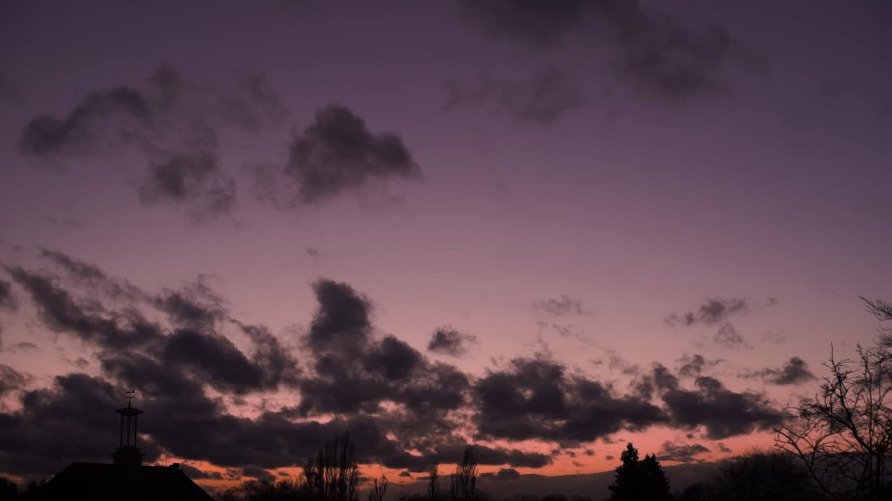 cumulus clouds moving at sunset sky time lapse silhouette clock tower