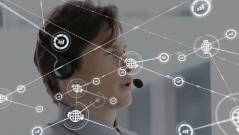 Animation-of-network-of-connections-and-icons-over-businessman-wearing-headset