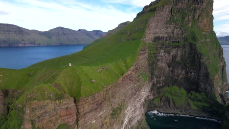 mossy cliff early in morning near sea