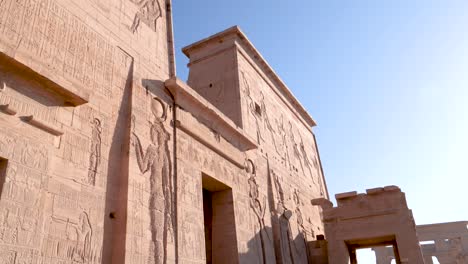 the entry of the ancient temple philae with hieroglyphs in aswan, egypt