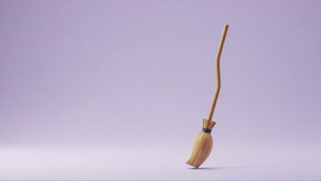 a charming broom on a soft purple background, perfectly capturing simplicity and elegance in a minimalist design approach