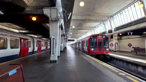 subway station with two trains on parallel tracks