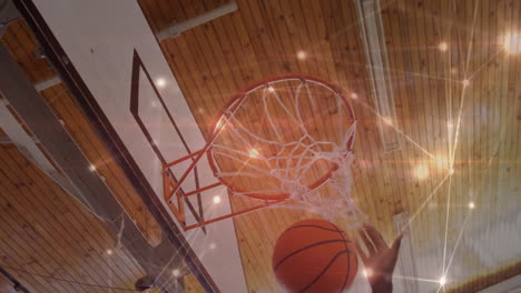 animation of networks of connections over biracial male basketball player at gym