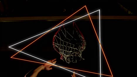 animation of orange and white neon triangles over basketball player scoring hoop