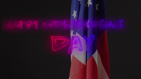 Animation-of-happy-independence-day-text-over-flag-of-america-on-black-background