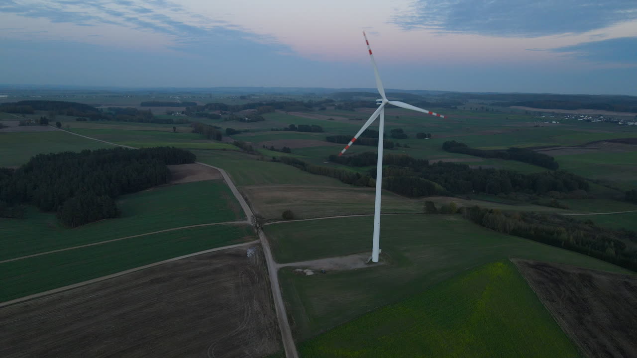Blue Sky Over Wind Turbines On Green Fields Near Countryside In Lubawa, Poland, Aerial Shot