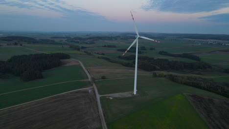 blue sky over wind turbines on green fields near countryside in lubawa, poland, aerial shot