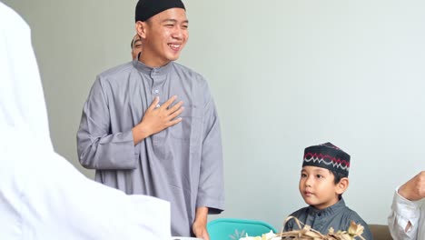 young muslim teenage boy apologize to his family during eid moment