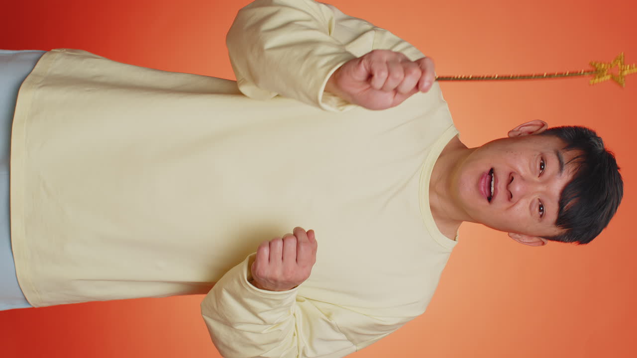 Magician wizard handsome man gesturing with magic wand making wish come true casting magician spell