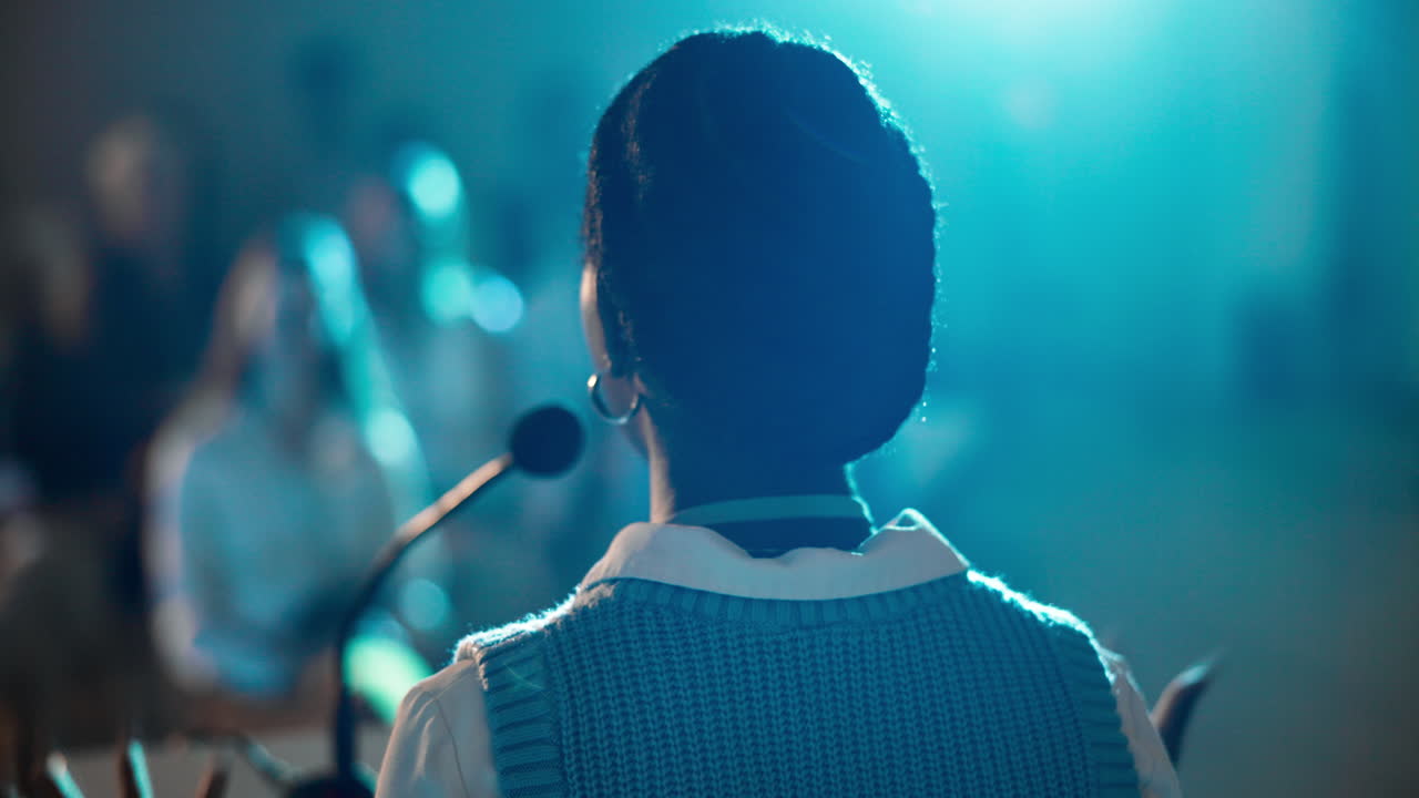 Woman Speaker Addressing Audience at a Conference Event