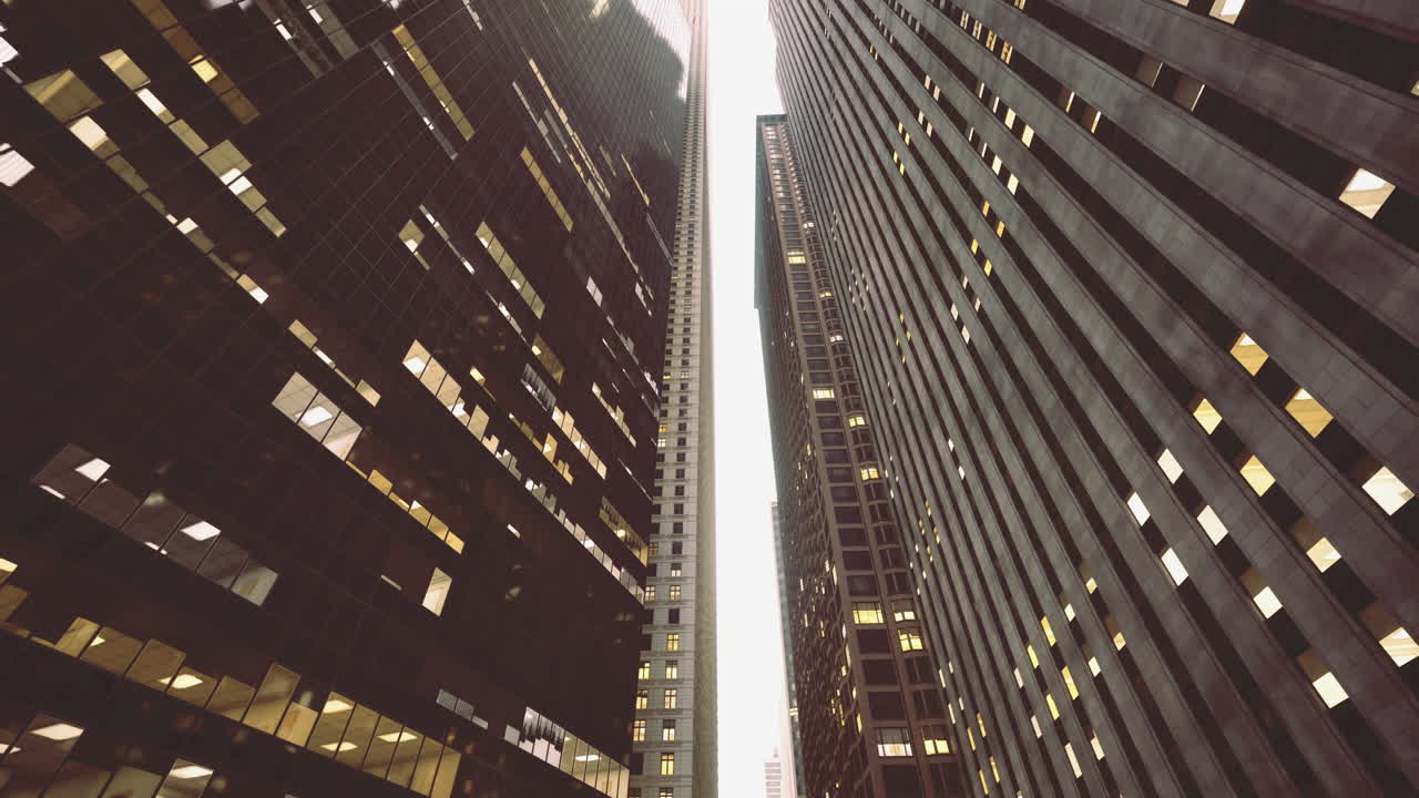 Skyscrapers tower above in urban setting during early evening light