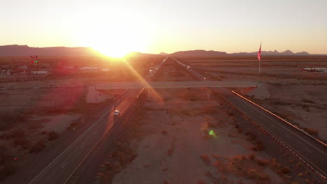 aerial cinematic drone shot above highway in california