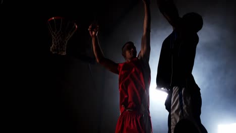 sportsmen playing basketball