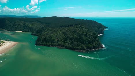 Boats-sailing-down-the-Whangamata-Estuary-at-high-tide