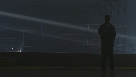 silhouette of a person in a boxing ring