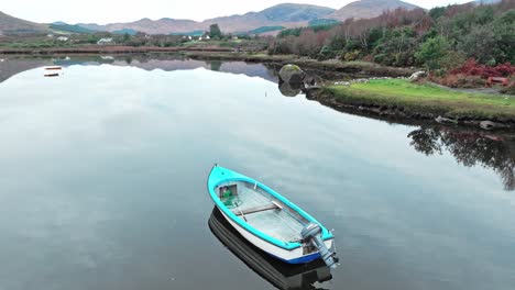 deone ring of kerry boat on still waters in sneem on the ring of kerry on a calm autumn morning