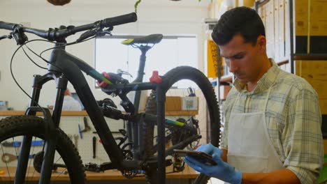 man using digital tablet in workshop 4k