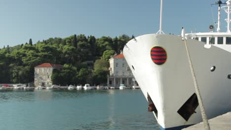 Boat-docked-to-port-on-calm-sea-water-in-Croatia