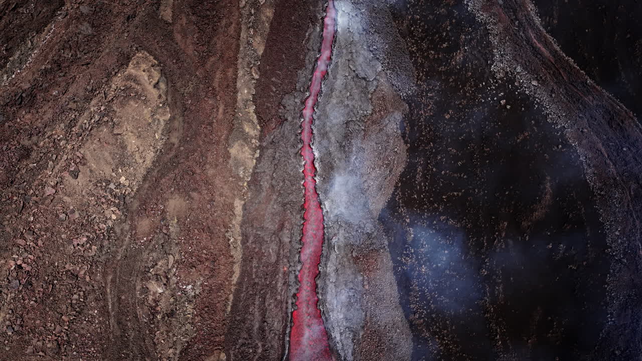 Dramatic aerial view of volcanic lava flow on Etna in Sicily