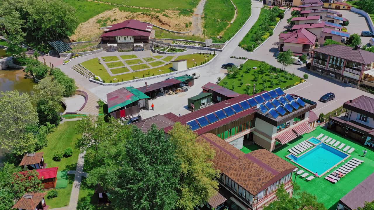 Resort complex from above. Aerial fly over of suburban resort complex