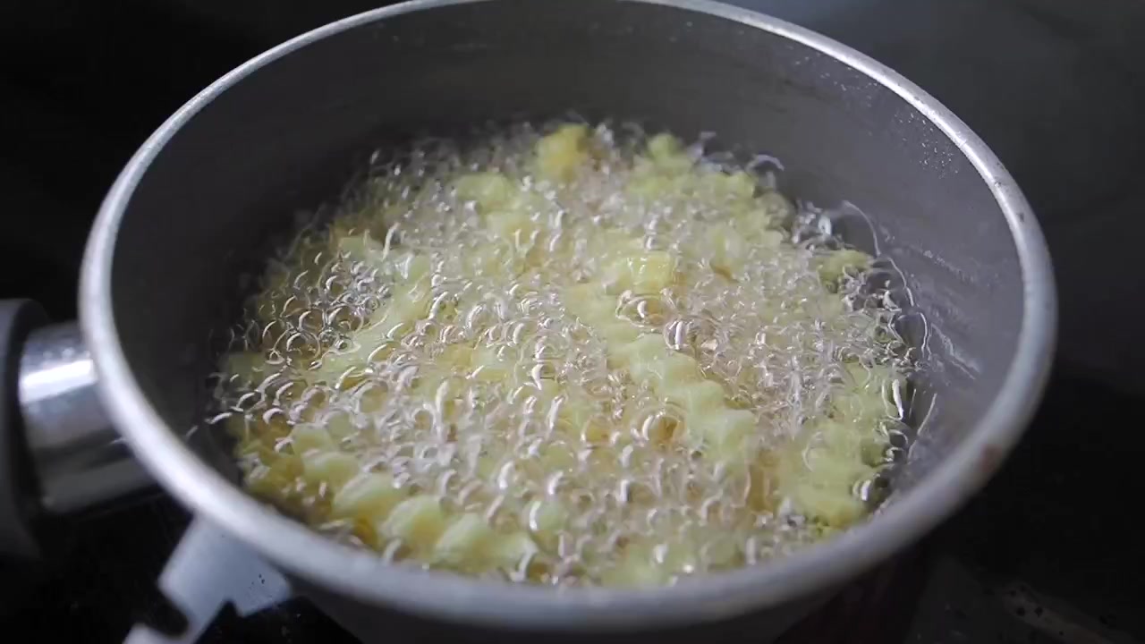 Crinkle Cut French Fries Deep Frying in Hot Oil