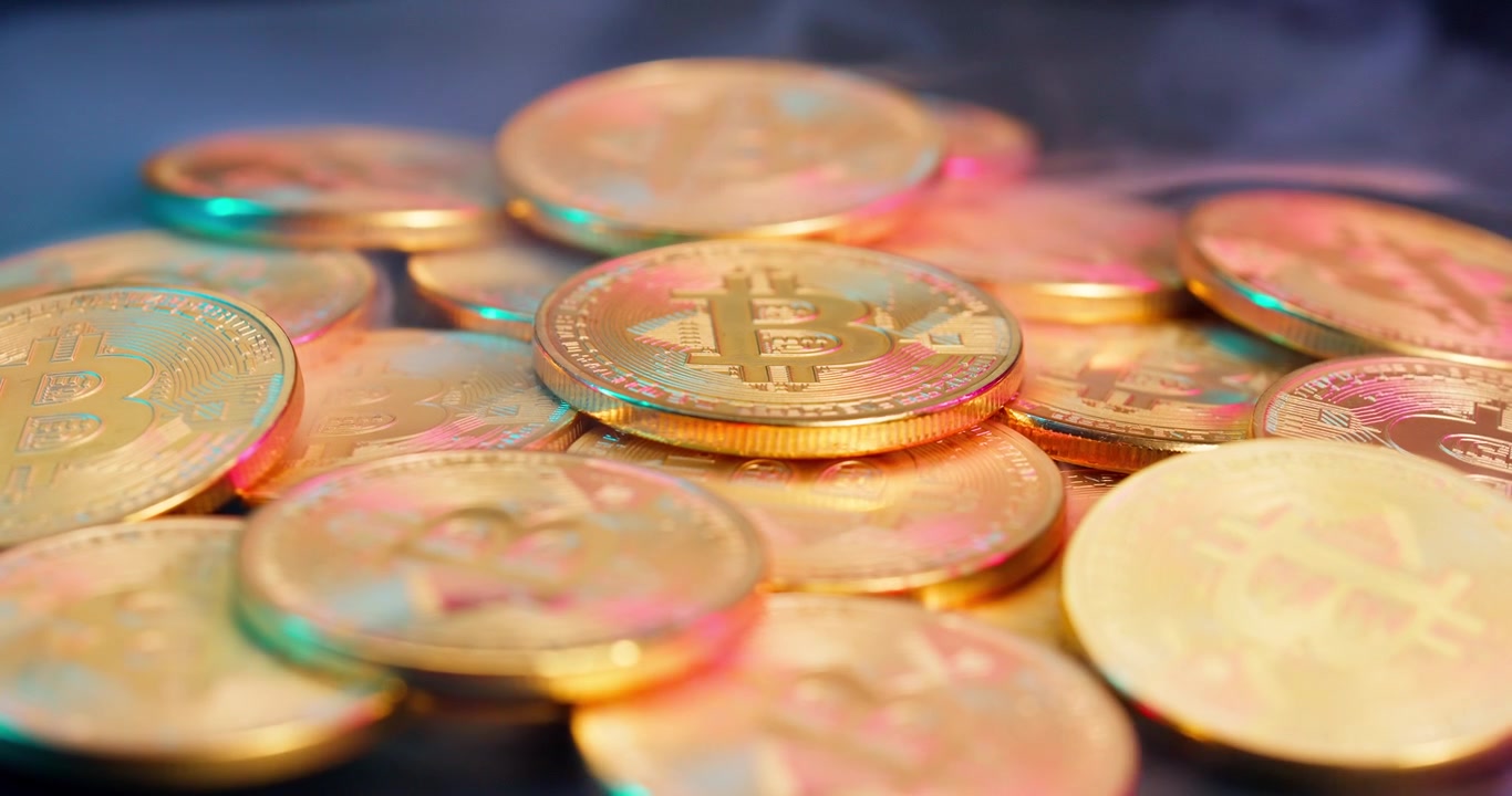 Golden Bitcoin Cryptocurrency Coins with Rising Smoke and Colorful Light